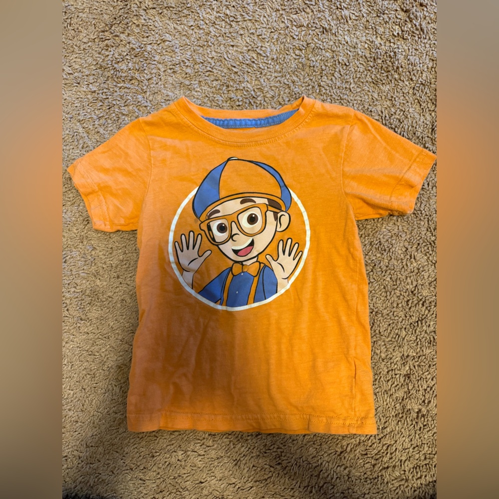 Vibrant Orange Kids Tee with Cartoon Design